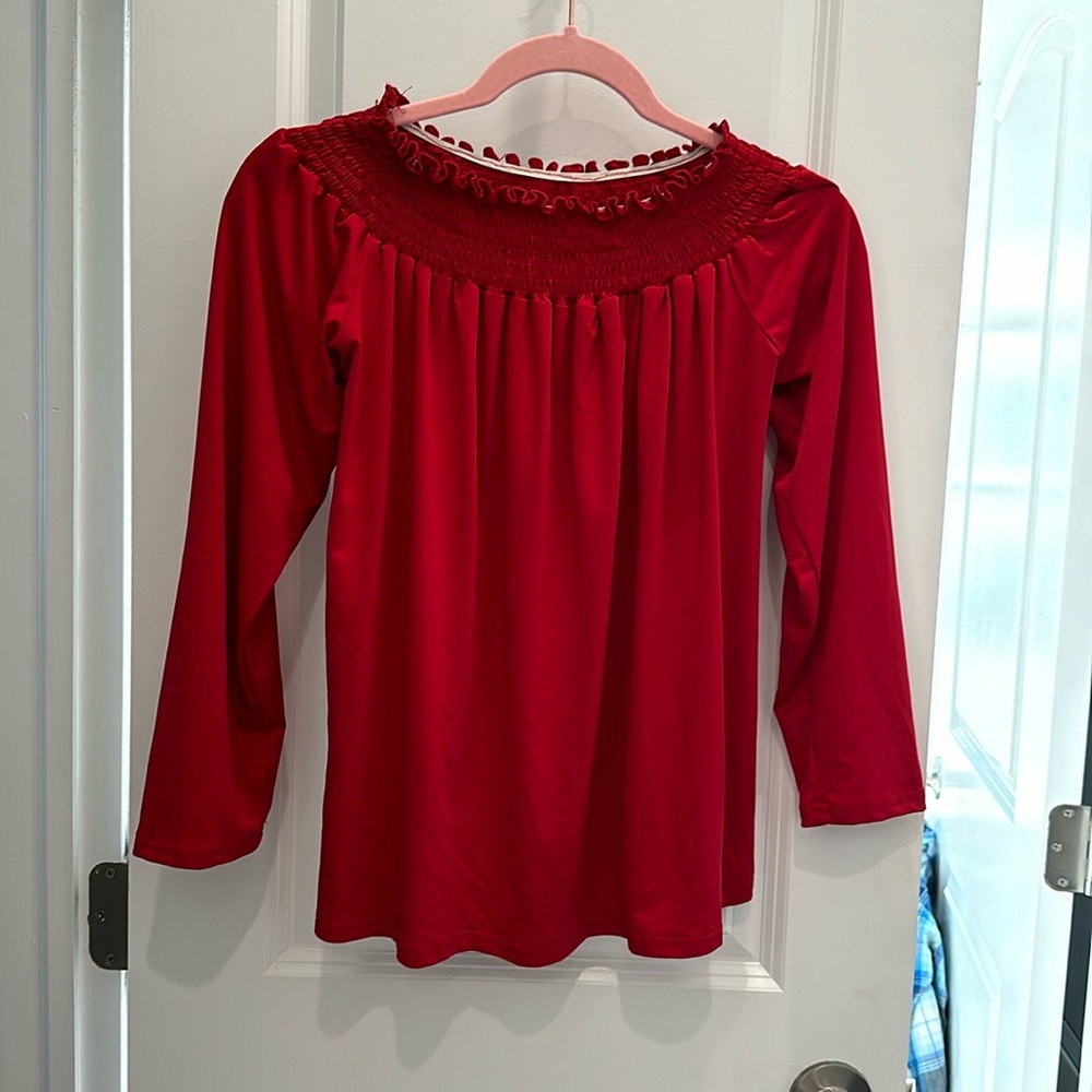 Red 3/4 sleeve shirt. Can be worn on or off the shoulder
